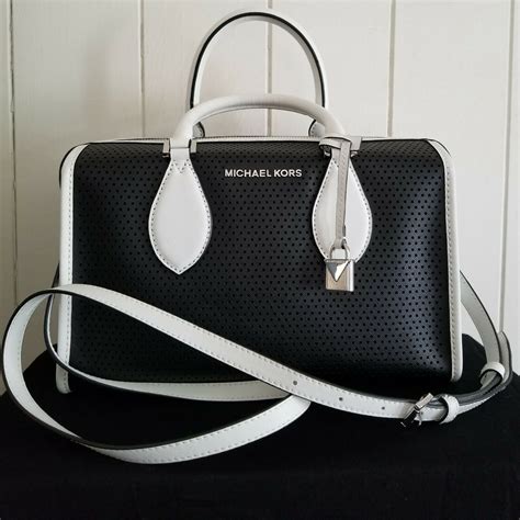 michael kors handbag black white|Michael Kors black shoulder handbags.